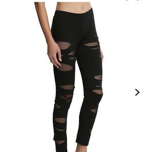 Leggings with rips fishnet underlay